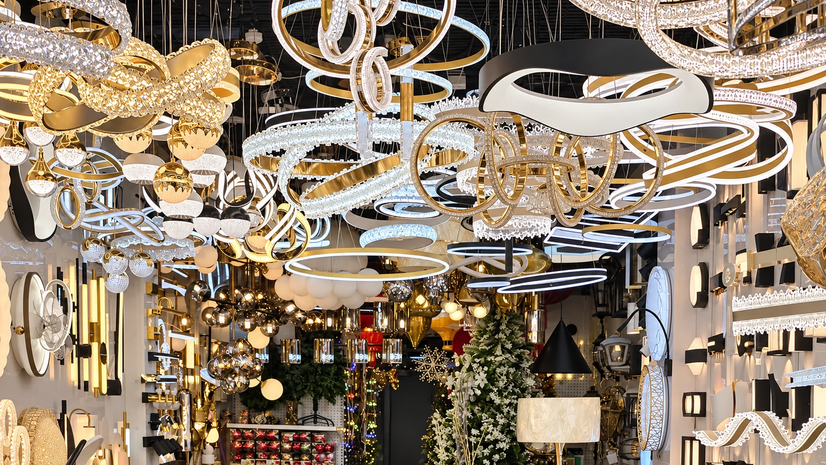 Chandeliers and pendant lights on display inside the Ever Rey showroom